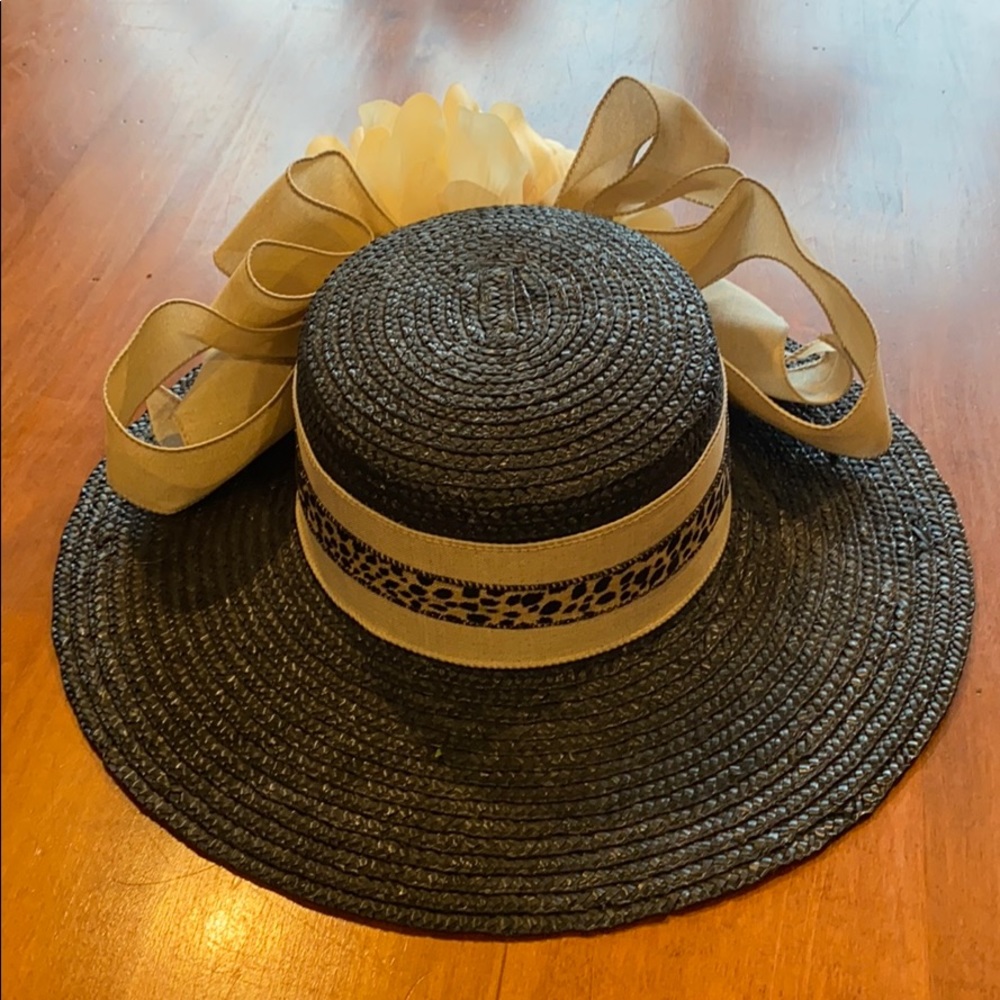 Women’s black straw hat with cheetah trim ribbon.